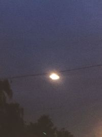 Low angle view of moon against clear sky