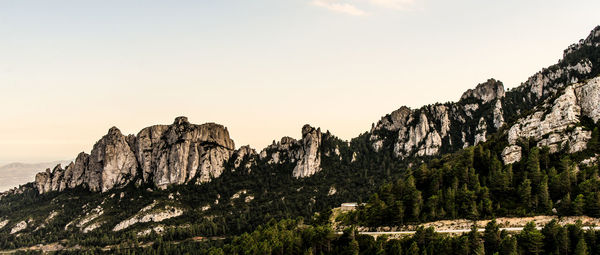 Panoramic view of rock formations on landscape against sky