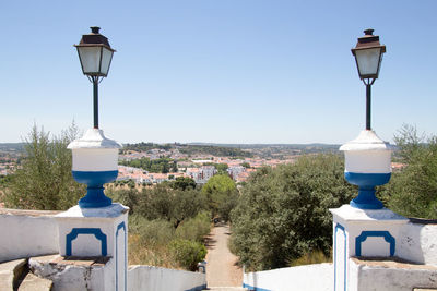 Street light against clear blue sky