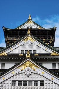 Low angle view of japanese castle building against sky