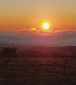 Scenic view of landscape at sunset