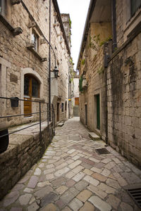 Narrow alley along buildings