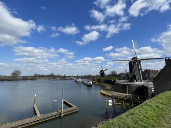 Panoramic view of commercial dock against sky