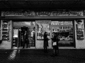 Rear view of people at store