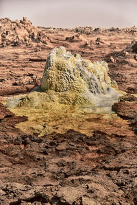 Scenic view of rocks in desert against sky