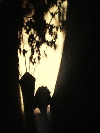 Silhouette built structures at sunset