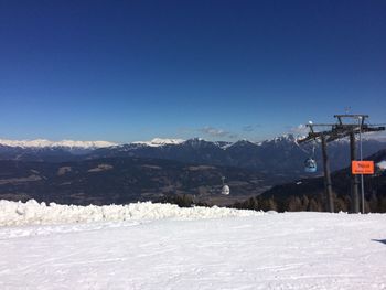 Scenic view of mountains against clear blue sky