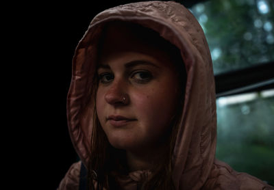 Close-up of young woman in darkroom