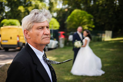 Portrait of young man standing outdoors