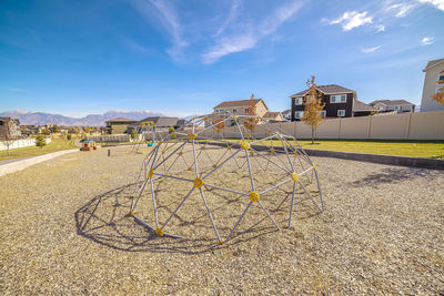 Panoramic view of building against sky on sunny day