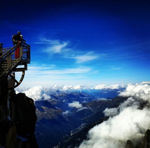 Scenic view of mountains against cloudy sky