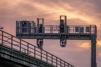Low angle view of bridge against sky during sunset