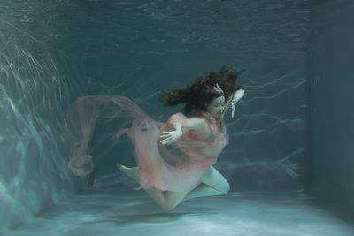 Woman swimming in pool