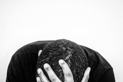 Close-up of man against white background
