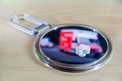 High angle view of pills on mirror over table