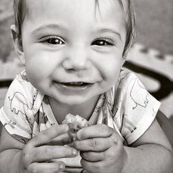 Close-up portrait of cute boy smiling