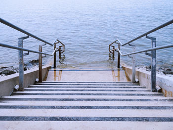 View of staircase leading to sea