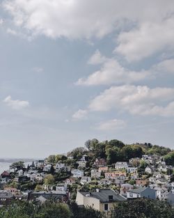 Houses in town against sky