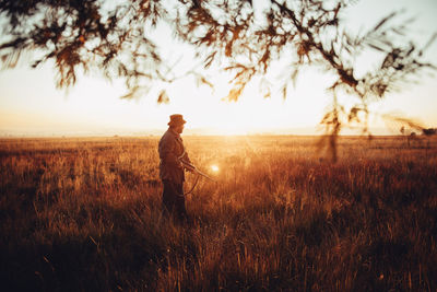 People walking on grassy field