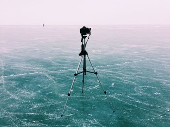 Tripod on frozen lake