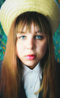 Close-up portrait of young woman wearing hat