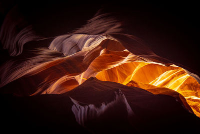 Low angle view of rock formations at night