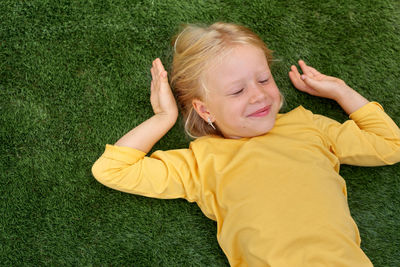 High angle view of cute girl playing with ball