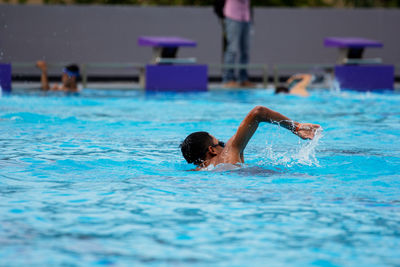 Man swimming in pool