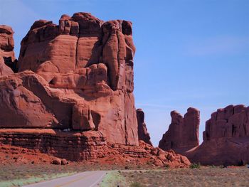 Rock formations on landscape against sky