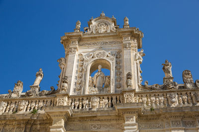 Low angle view of historical building against blue sky