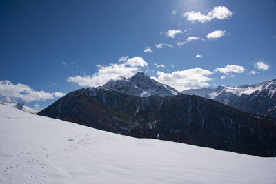 Scenic view of snowcapped mountains against sky