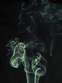 Close-up of smoke against black background