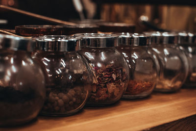 Glass jars with different types of tea leaves. herbal natural organic collection