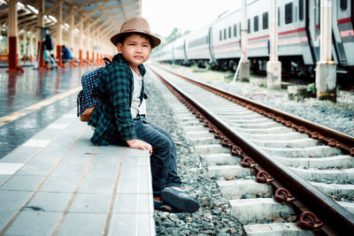 Portrait of man on railroad station platform