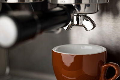 A closeup shot of an espresso coffee machine