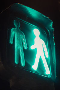 Low angle view of illuminated road sign