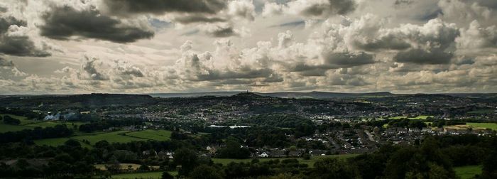 Scenic view of landscape against cloudy sky