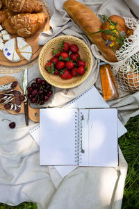 Empty open notepad. summer paper mockup on the background of bright picnic