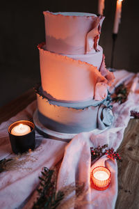 Close-up of lit tea light candles in temple