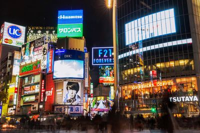 Graffiti on illuminated building at night