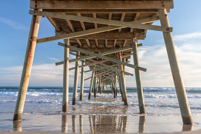 Pier over sea against sky