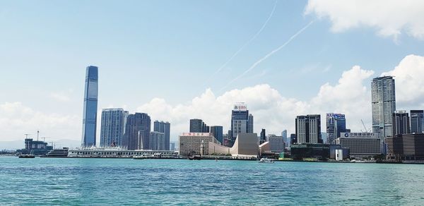Modern buildings in city against sky