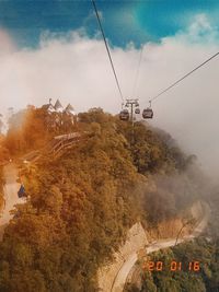 High angle view of overhead cable car against sky