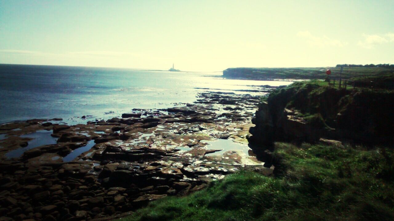 sea, horizon over water, water, tranquil scene, scenics, tranquility, rock - object, beauty in nature, nature, coastline, rock formation, sky, cliff, rock, transportation, shore, idyllic, beach, high angle view, mode of transport