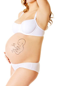 Midsection of woman standing against white background