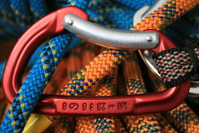 Close-up of climbing ropes connected by carabiner