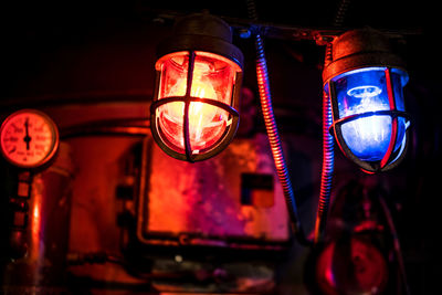 Low angle view of illuminated lighting equipment