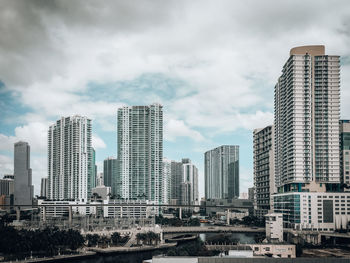 Modern buildings in city against sky