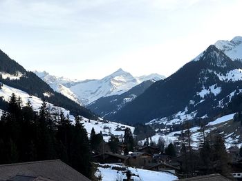 Scenic view of snow mountains against sky