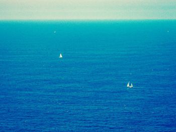 Scenic view of sea against blue sky